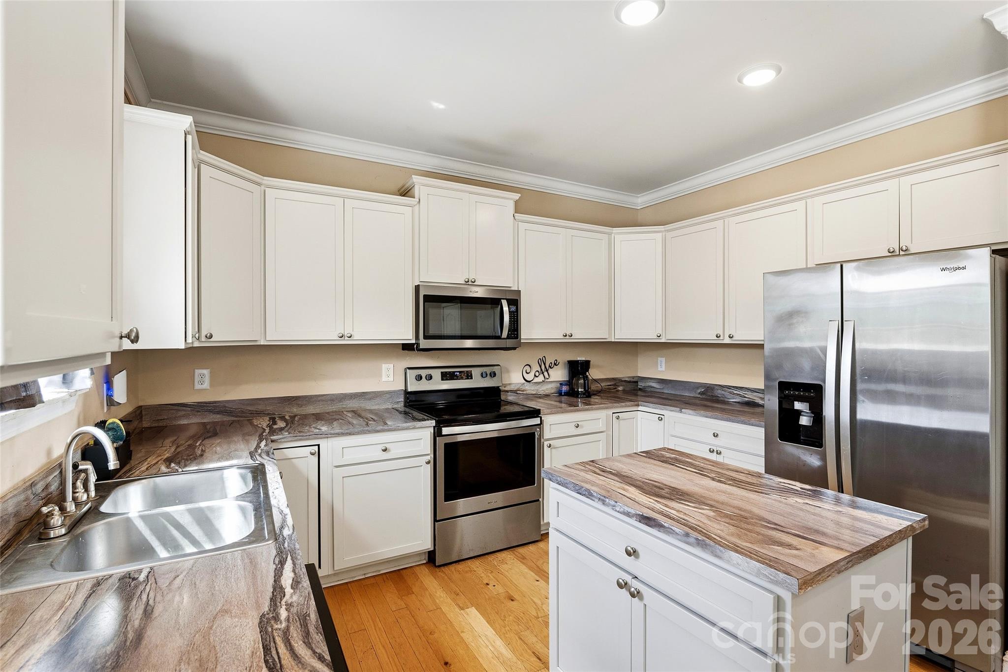 26 Brigman Road Weaverville, NC 28787 - Photo 11 of 27 a kitchen with a sink stove and refrigerator