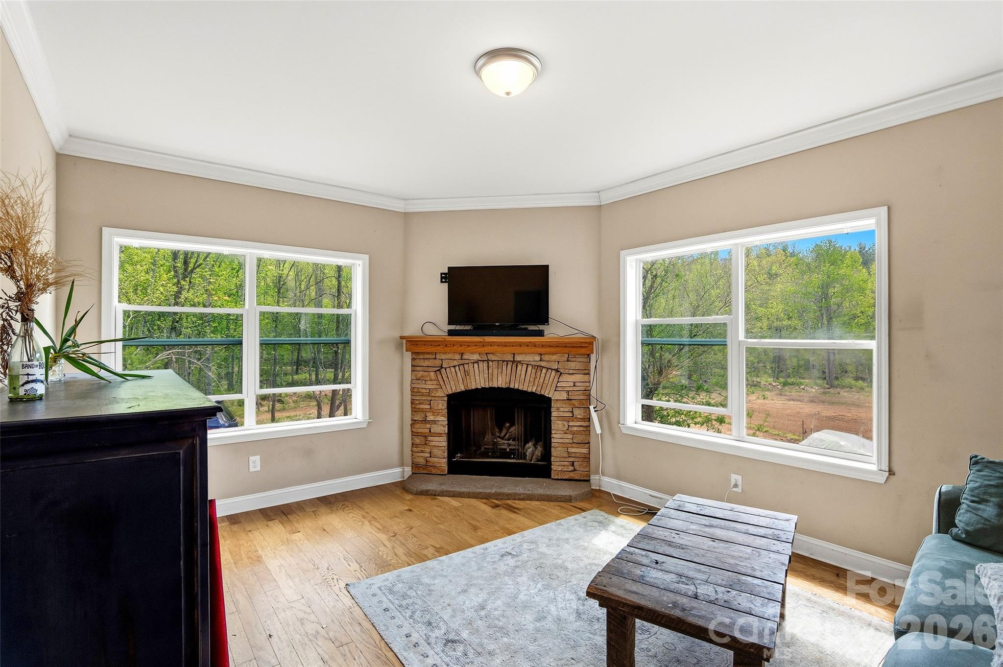 26 Brigman Road Weaverville, NC 28787 - Photo 7 of 27 a living room with furniture and a fireplace