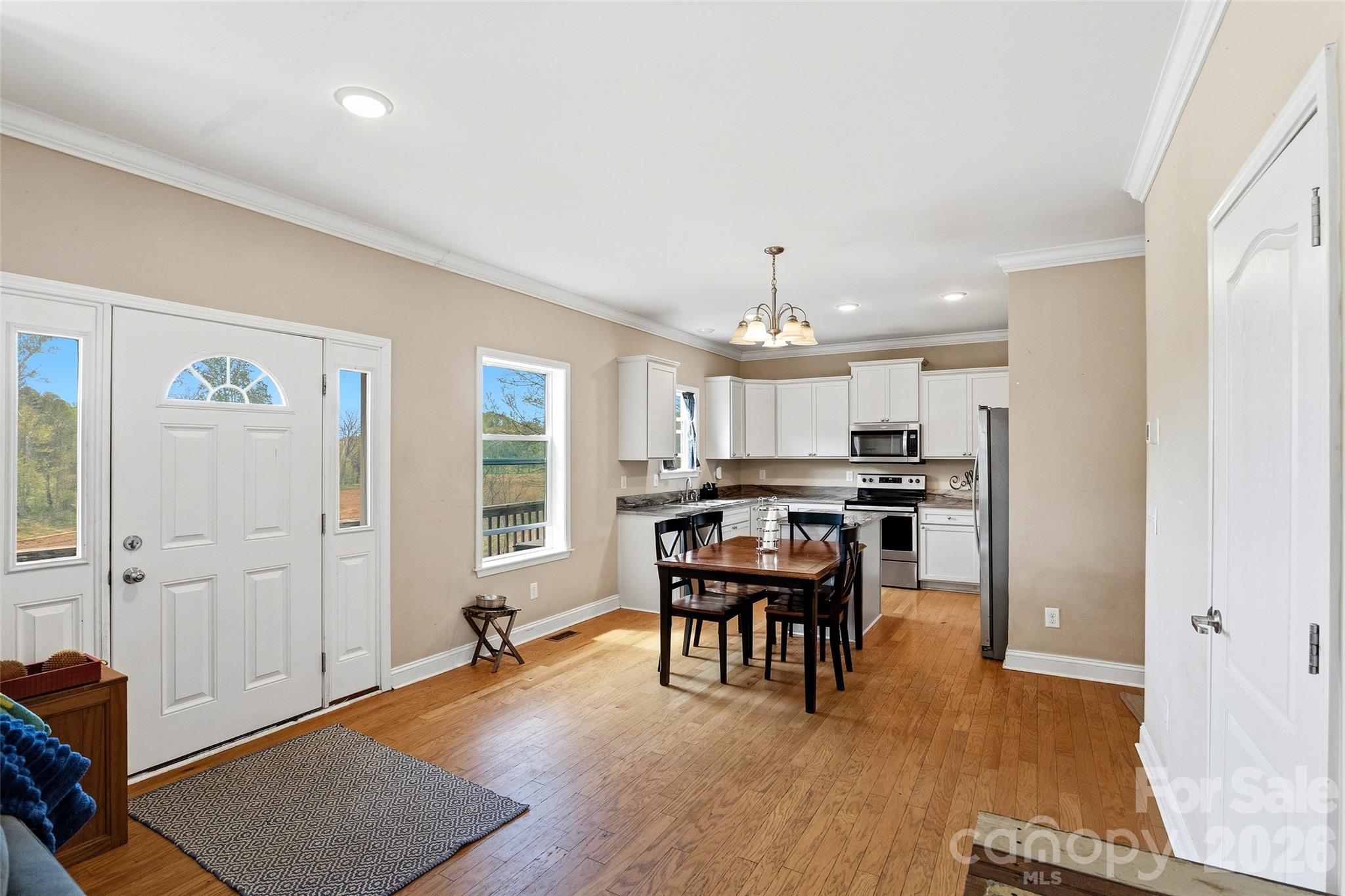 26 Brigman Road Weaverville, NC 28787 - Photo 8 of 27 a view of a dining room with furniture window and wooden floor