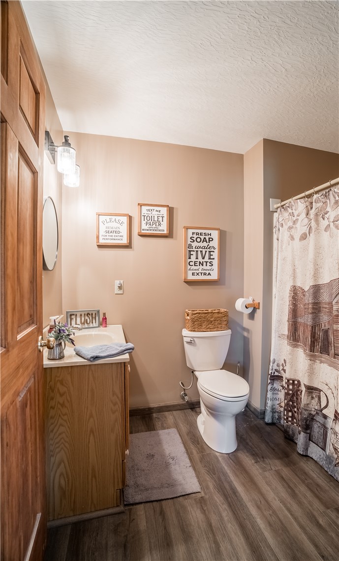 1319 Perry Road Cable, OH 43009 - Photo 20 of 44 This bathroom features durable flooring, an inviting ambiance, and tasteful fixtures for everyday comfort.