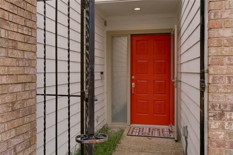 a view of a door and wooden floor