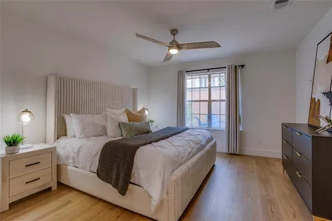 a bedroom with bed and window