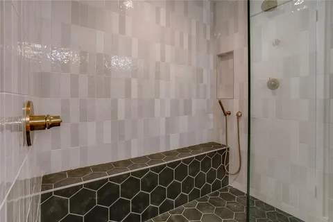 a bathroom with a double vanity sink and mirror