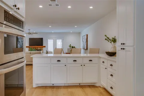 a living room with table chairs and a couch