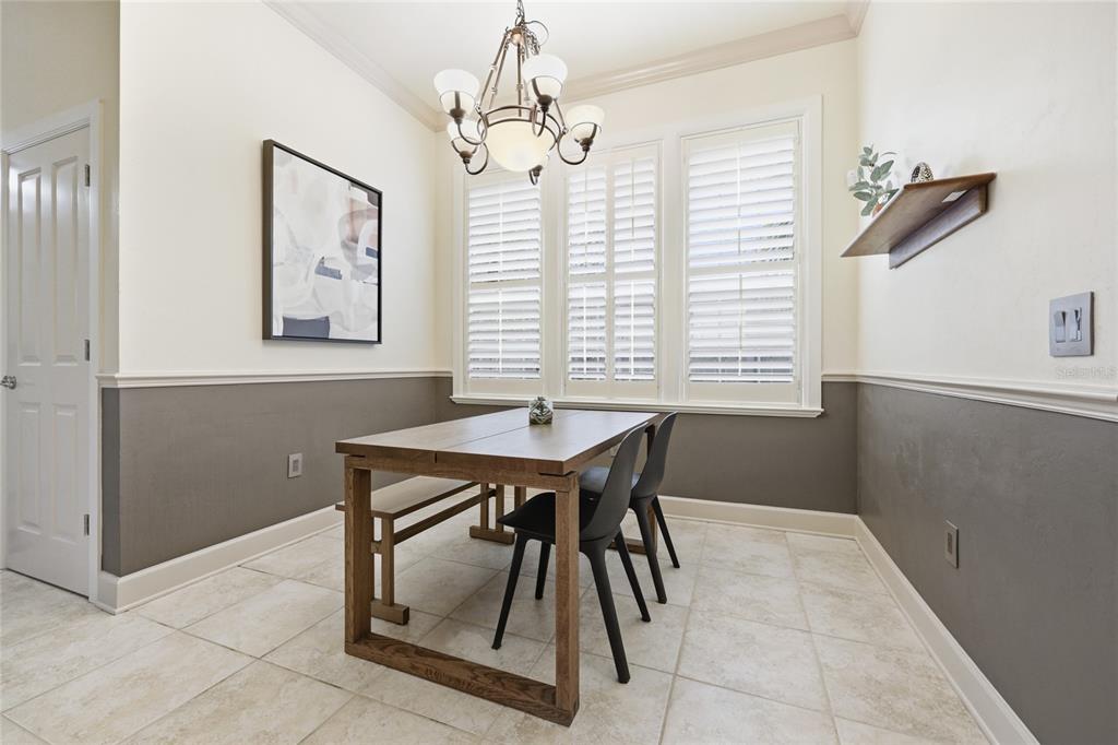 9255 Southwest 29 Avenue Gainesville, FL 32608 - Photo 18 of 79 a dining room with a table and chairs