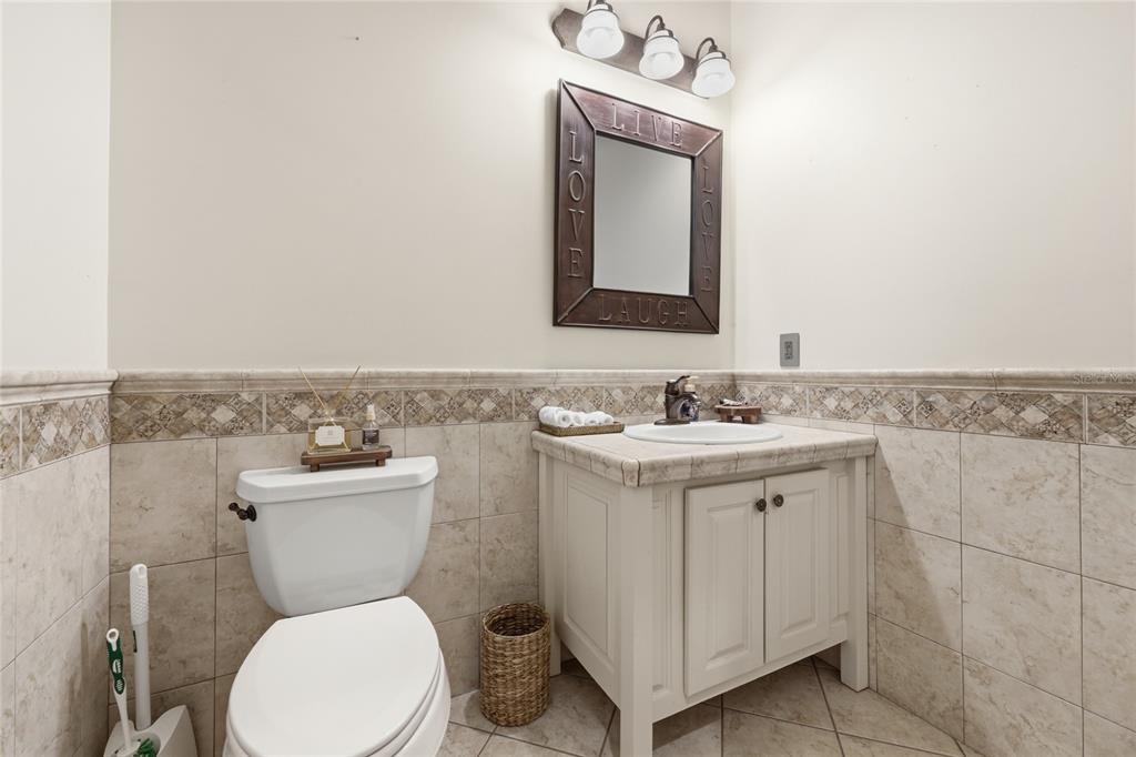 9255 Southwest 29 Avenue Gainesville, FL 32608 - Photo 20 of 79 a bathroom with a toilet sink and mirror