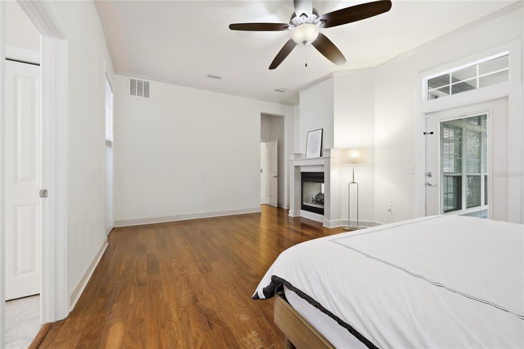 9255 Southwest 29 Avenue Gainesville, FL 32608 - Photo 27 of 79 a bedroom with a bed and a chandelier