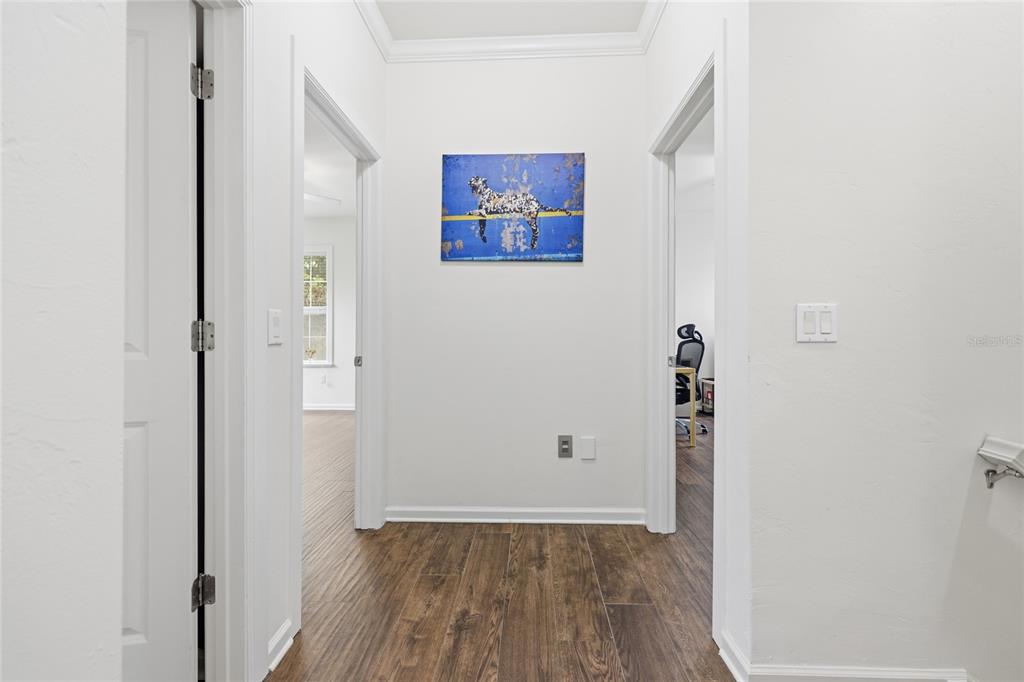 9255 Southwest 29 Avenue Gainesville, FL 32608 - Photo 37 of 79 an empty room with wooden floor and windows