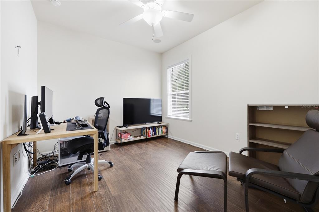 9255 Southwest 29 Avenue Gainesville, FL 32608 - Photo 38 of 79 a view of a workspace with furniture and a window