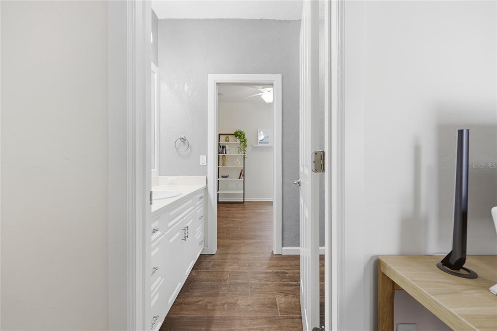 9255 Southwest 29 Avenue Gainesville, FL 32608 - Photo 42 of 79 a bathroom with a sink and a mirror