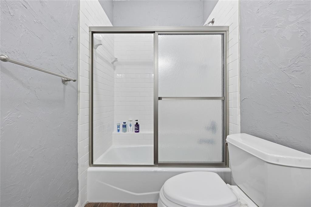 9255 Southwest 29 Avenue Gainesville, FL 32608 - Photo 44 of 79 a white toilet sitting next to a bathroom sink