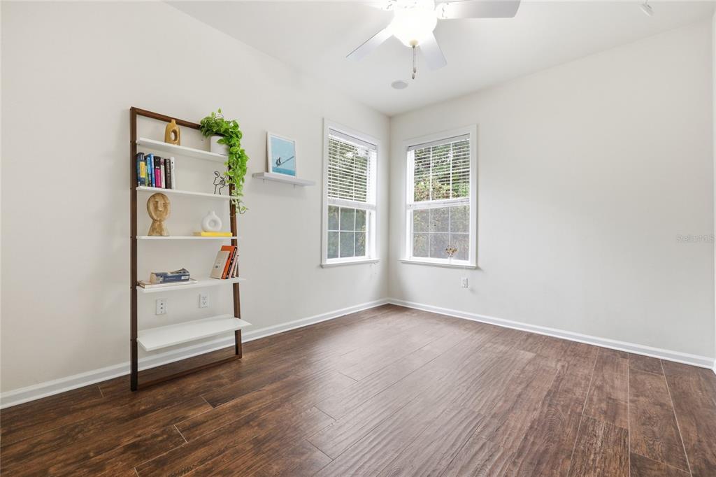 9255 Southwest 29 Avenue Gainesville, FL 32608 - Photo 45 of 79 a view of an empty room with a window and wooden floor