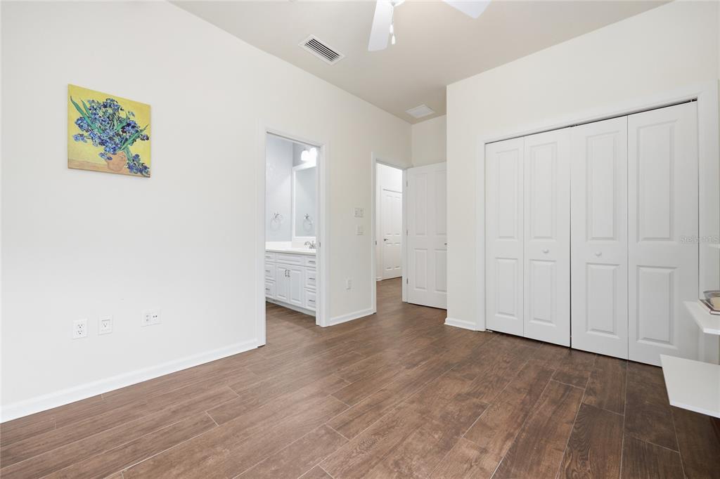 9255 Southwest 29 Avenue Gainesville, FL 32608 - Photo 47 of 79 a view of an empty room and wooden floor