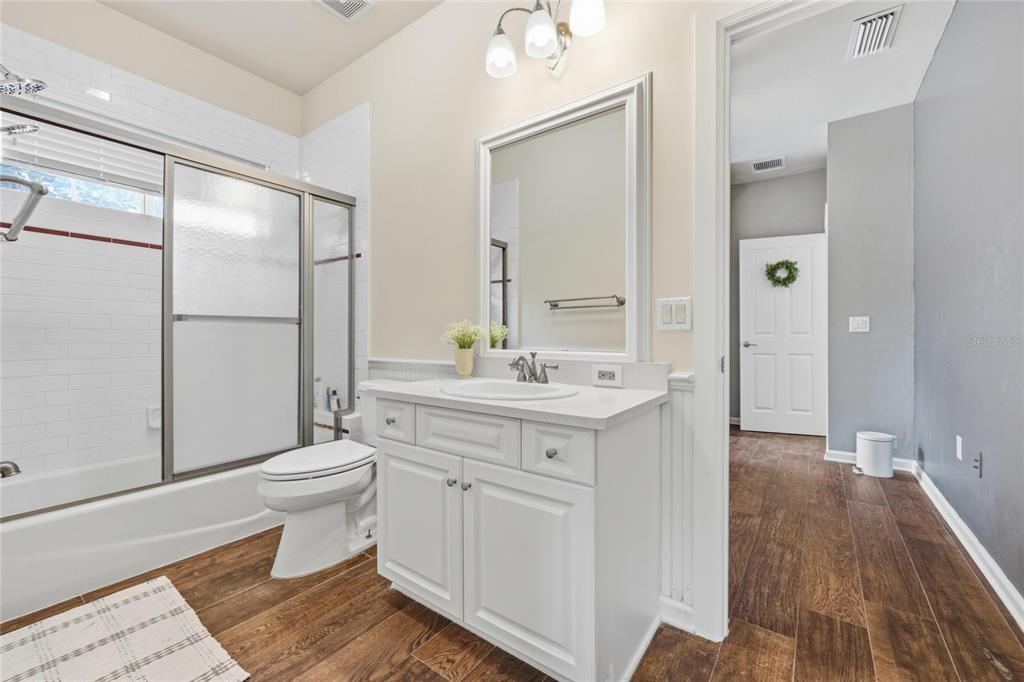 9255 Southwest 29 Avenue Gainesville, FL 32608 - Photo 52 of 79 a spacious bathroom with a sink a toilet a shower and a mirror