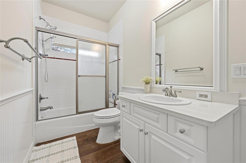 9255 Southwest 29 Avenue Gainesville, FL 32608 - Photo 53 of 79 a bathroom with a sink toilet a mirror and shower