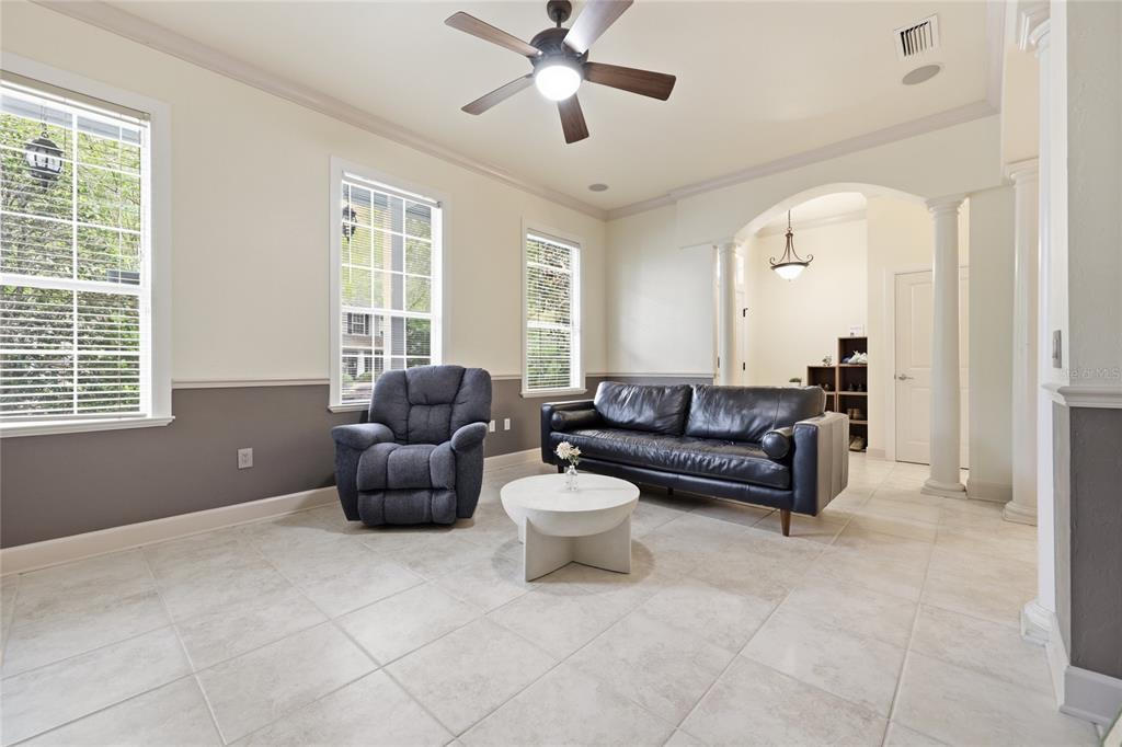 9255 Southwest 29 Avenue Gainesville, FL 32608 - Photo 6 of 79 a living room with furniture and a large window