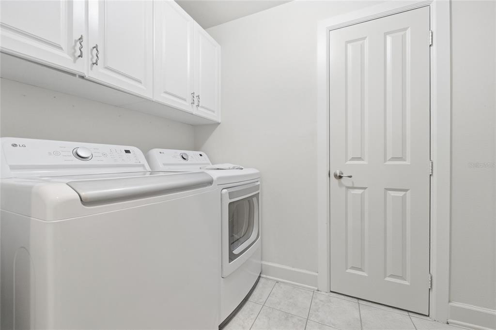 9255 Southwest 29 Avenue Gainesville, FL 32608 - Photo 63 of 79 a utility room with dryer and washer