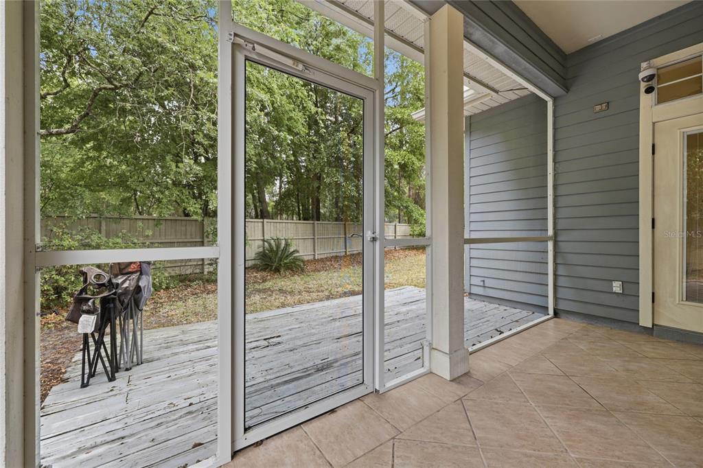 9255 Southwest 29 Avenue Gainesville, FL 32608 - Photo 65 of 79 a view of a porch with wooden floor