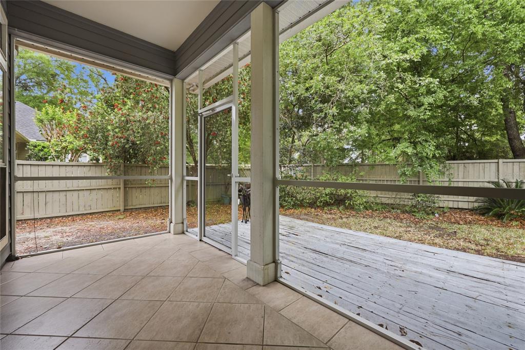 9255 Southwest 29 Avenue Gainesville, FL 32608 - Photo 66 of 79 a view of a room with wooden floor and outdoor space