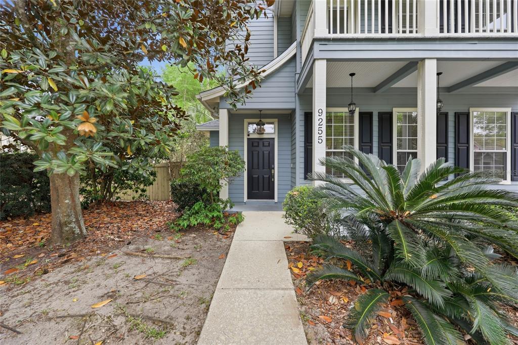 9255 Southwest 29 Avenue Gainesville, FL 32608 - Photo 72 of 79 front view of a brick house with potted plants