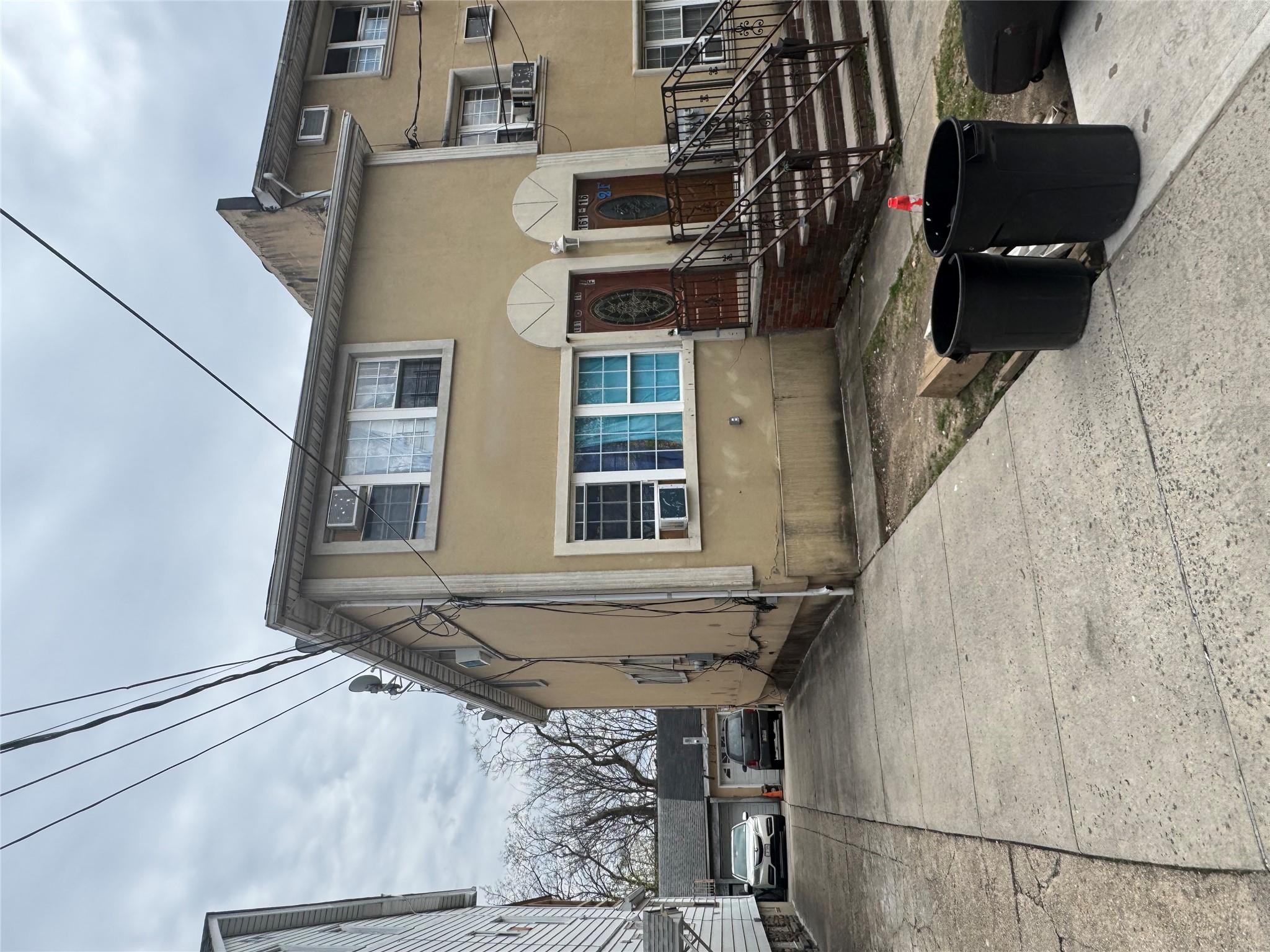 16116 Normal Road Queens, NY 11432 - Photo 1 of 5 a front view of a house with yard
