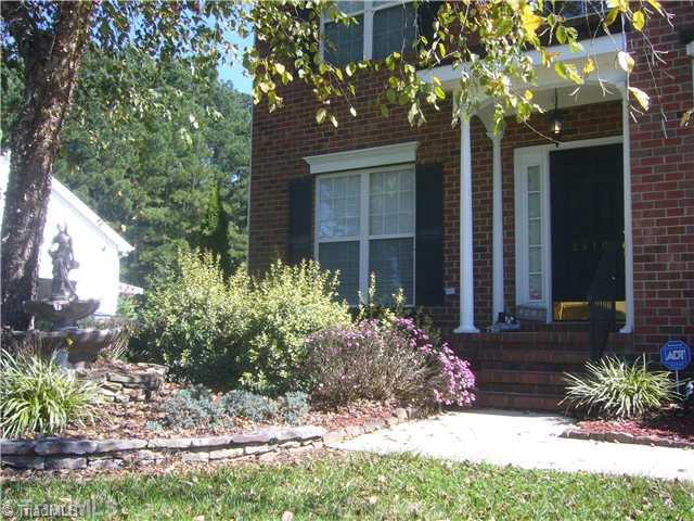 2810 Norwell Court Oak Ridge, NC 27310 - Photo 2 of 14 Exterior Front. The landscaping features stone wall borders, established shrubs and trees, and great foundation landscaped areas. There is a covered front porch area and a freshly painted and cleaned exterior.