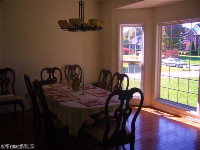 2810 Norwell Court Oak Ridge, NC 27310 - Photo 3 of 14 Dining Room. The dining room is bright and airy with the fully floored bay window that overlooks the front yard. Note the hardwood flooring and the 9 ceiling heights.