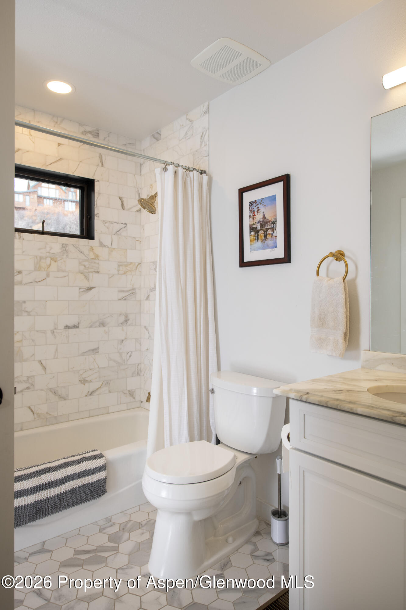 450 Solar Way Aspen, CO 81611 - Photo 25 of 51 a white toilet sitting next to a bathroom sink