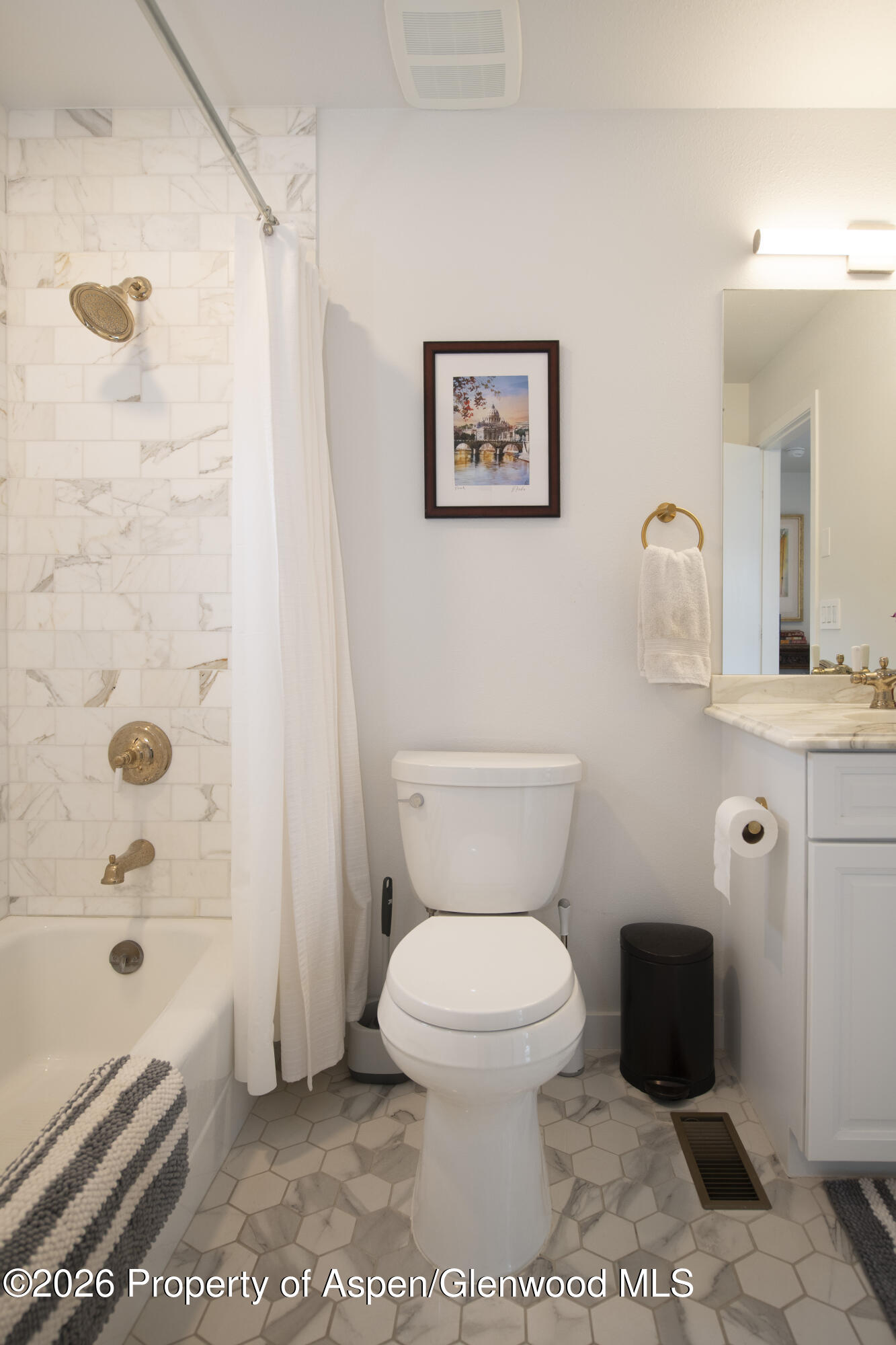 450 Solar Way Aspen, CO 81611 - Photo 26 of 51 a bathroom with a toilet a sink and bathtub