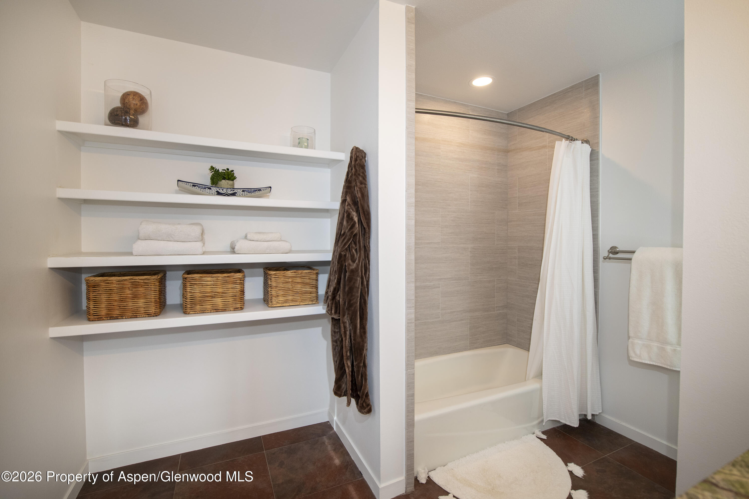 450 Solar Way Aspen, CO 81611 - Photo 28 of 51 a bathroom with a bathtub and a shower