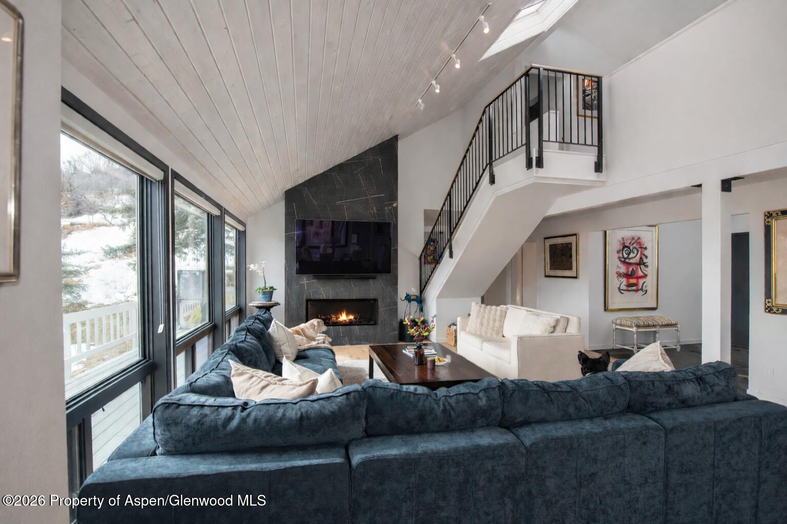 450 Solar Way Aspen, CO 81611 - Photo 4 of 51 a living room with furniture and a large window