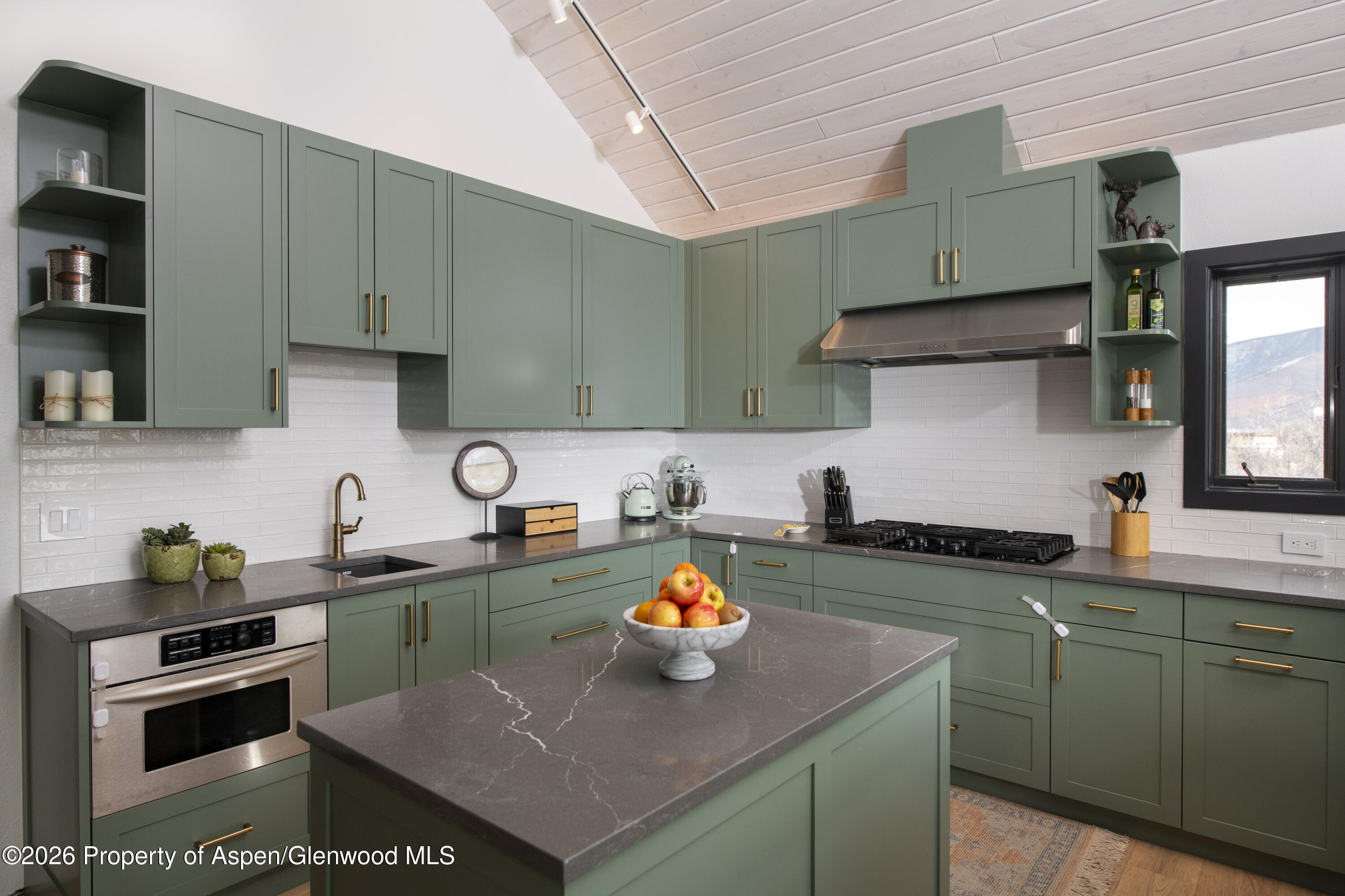 450 Solar Way Aspen, CO 81611 - Photo 5 of 51 a kitchen with stainless steel appliances granite countertop a sink and a stove