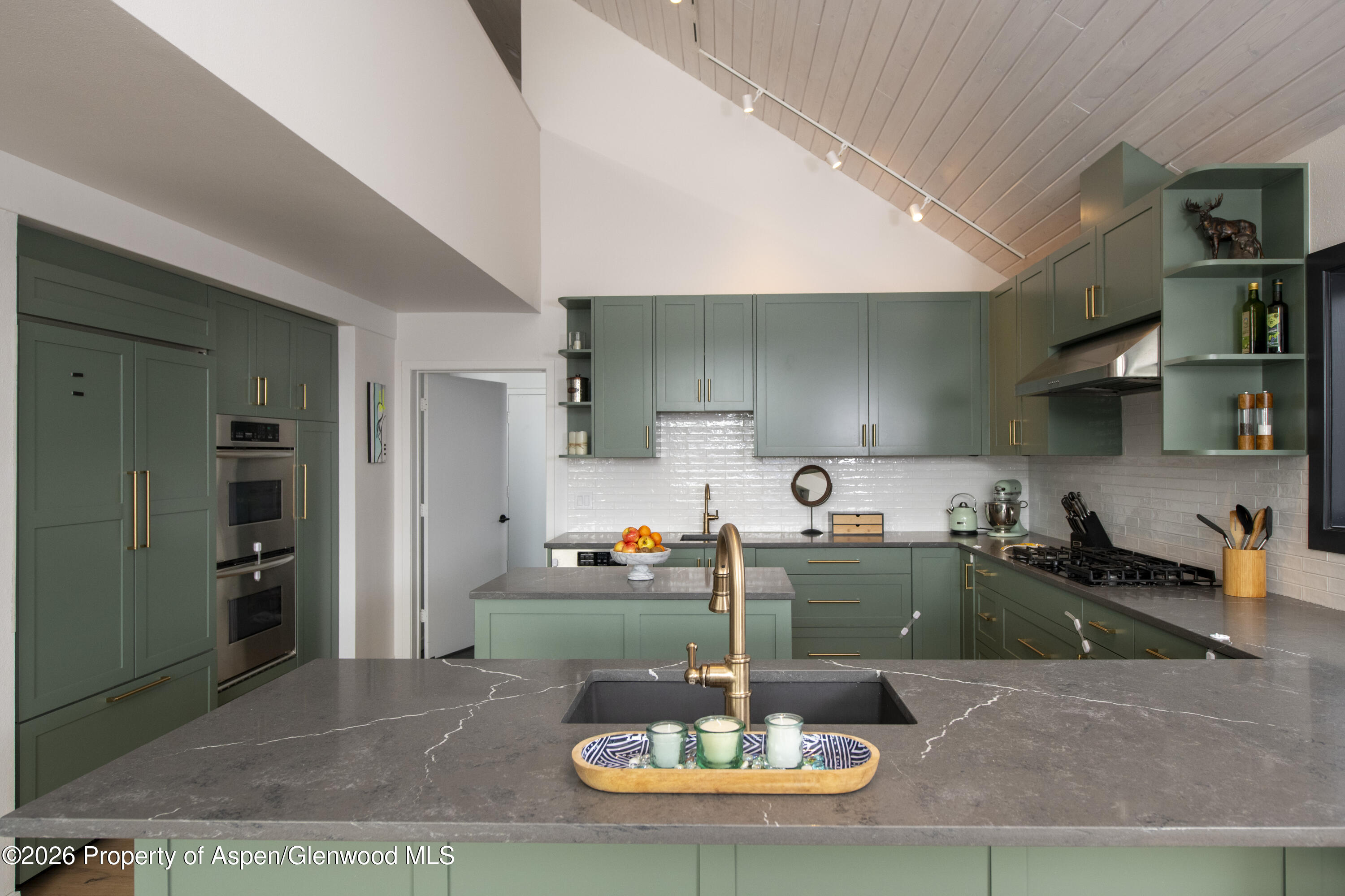 450 Solar Way Aspen, CO 81611 - Photo 6 of 51 a kitchen with a table and chairs