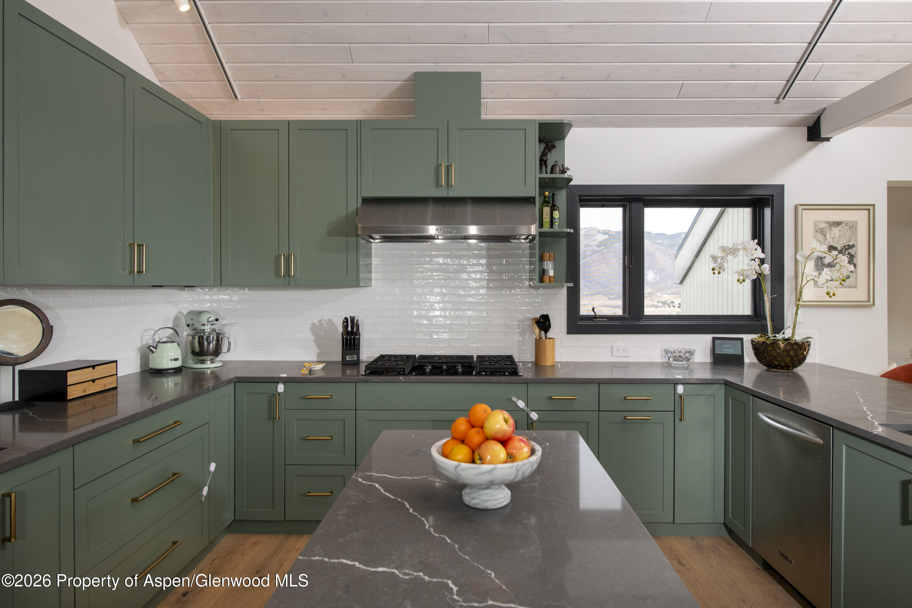 450 Solar Way Aspen, CO 81611 - Photo 7 of 51 a kitchen with a sink and cabinets