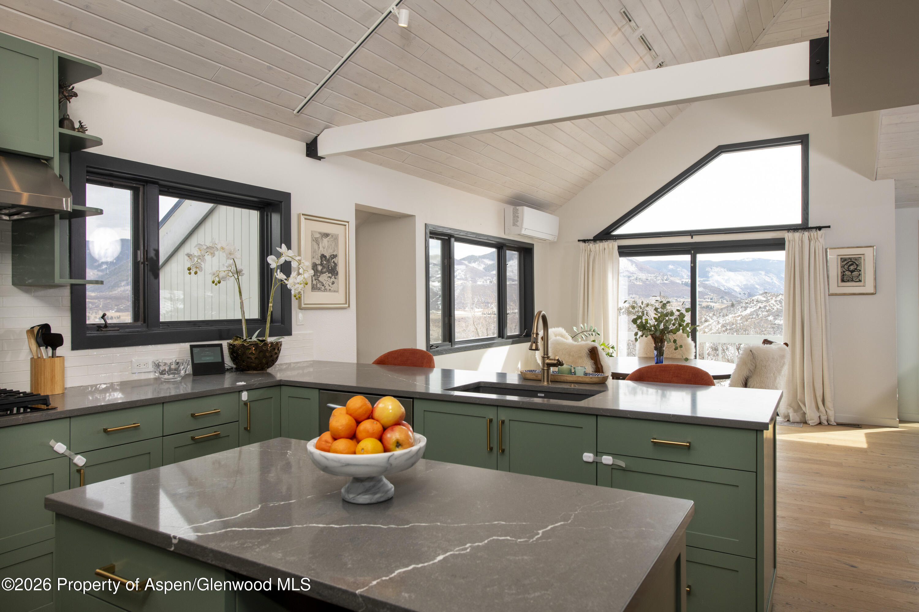 450 Solar Way Aspen, CO 81611 - Photo 8 of 51 a kitchen with a sink and a large window