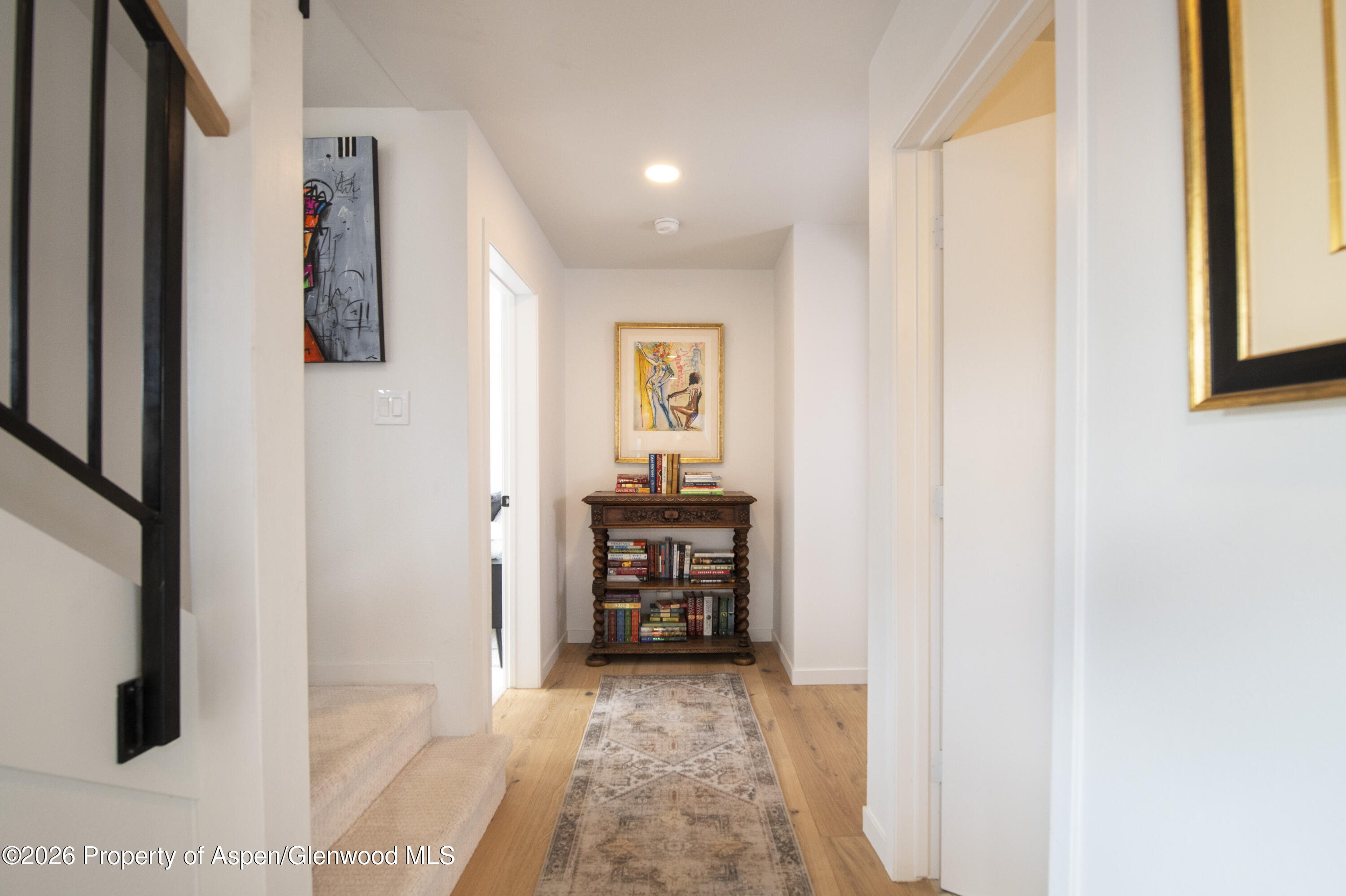 450 Solar Way Aspen, CO 81611 - Photo 10 of 51 a view of a hallway to rooms and stairs