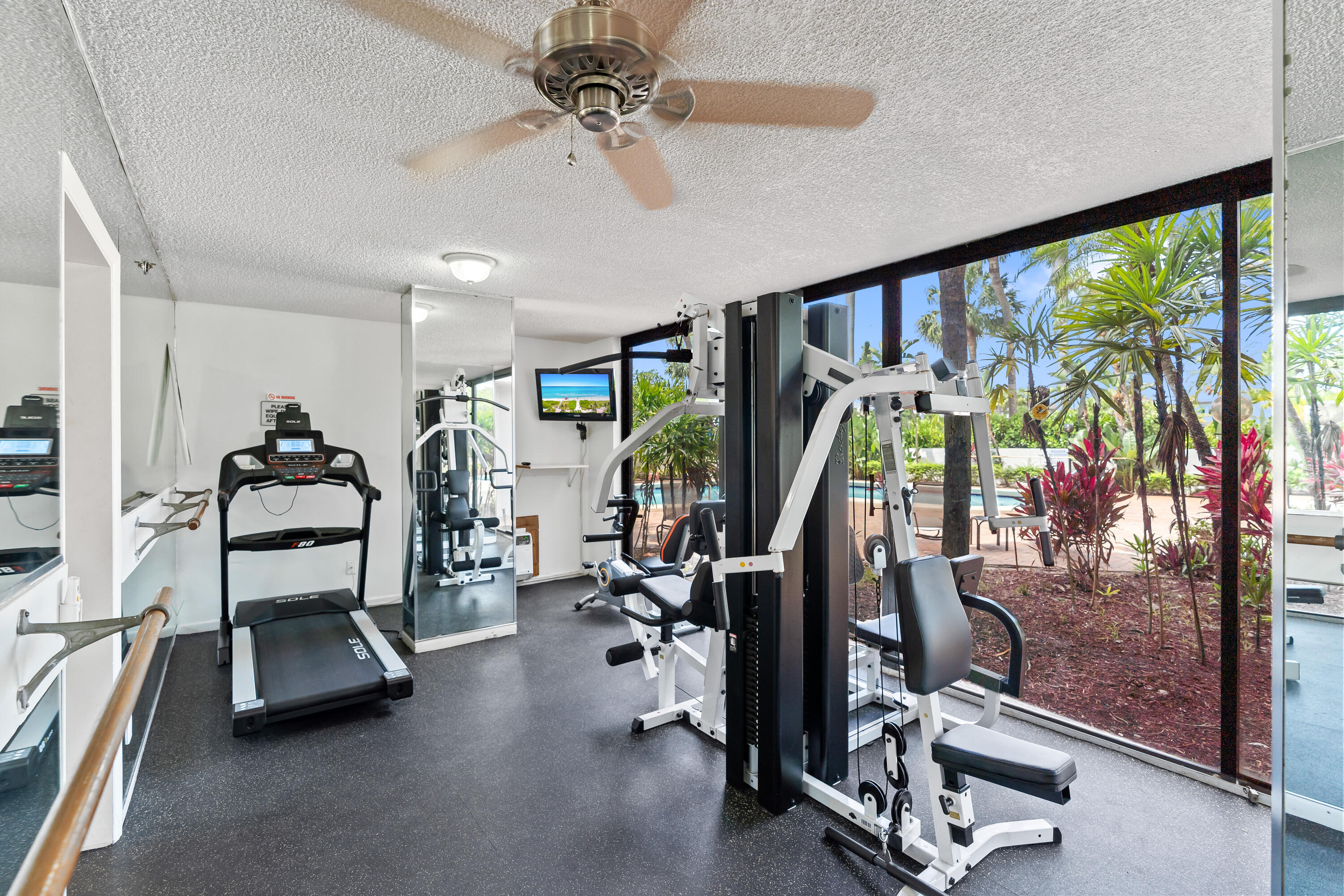 23200 Camino Del Mar, Unit 603 Boca Raton, FL 33433 - Photo 42 of 43 a view of a room with gym equipment