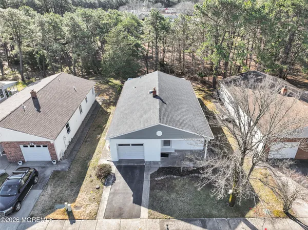 a aerial view of a house with a yard