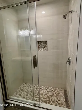 a bathroom with a sink and mirror