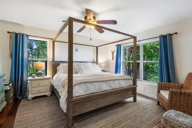 a bathroom with a tub a sink and a shower