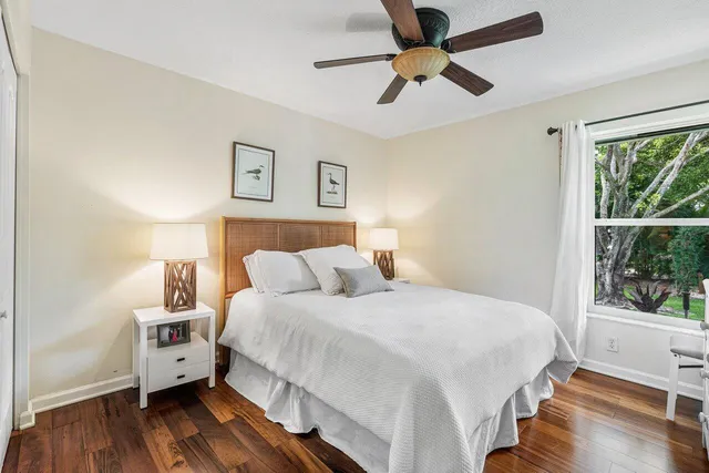 a living room with furniture a chandelier and a window