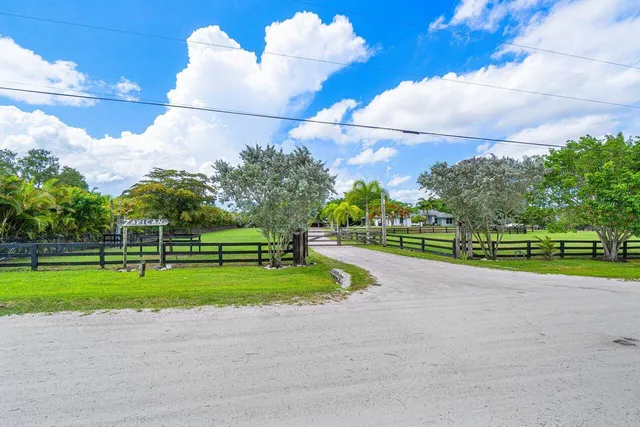 a view of a swimming pool with chairs