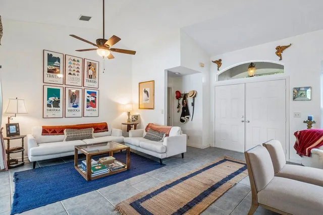 a view of a swimming pool with a garden and trees