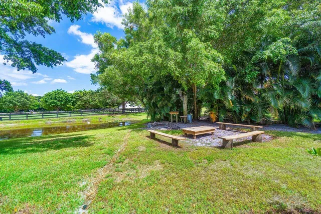 a view of a garden with a lake view