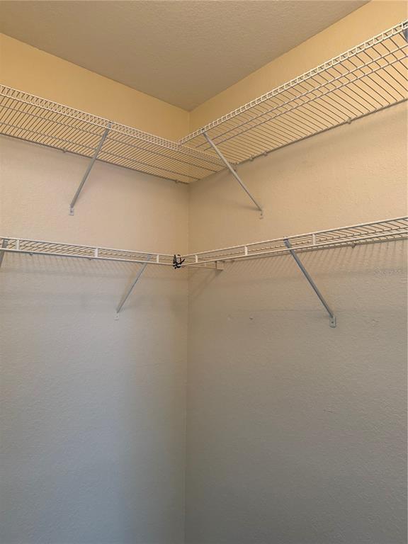 3725 Conroy Road, Unit 2127 Orlando, FL 32839 - Photo 25 of 30 a view of a room with racks on the wall