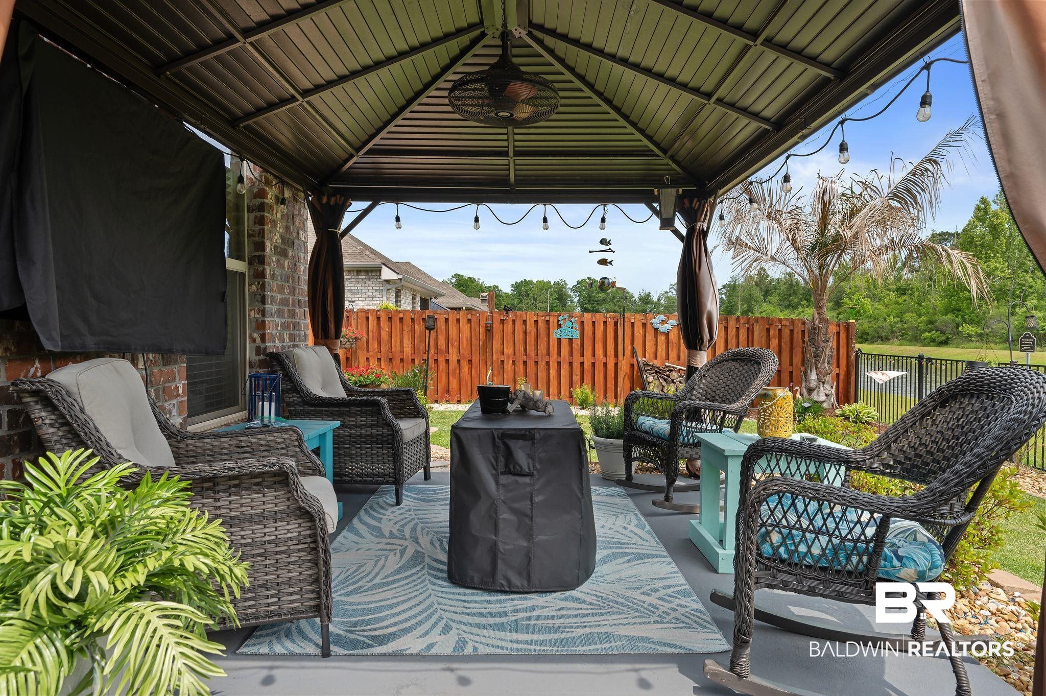 1165 Stella Road Foley, AL 36535 - Photo 32 of 42 View of patio with a gazebo, an outdoor hangout area, and fence