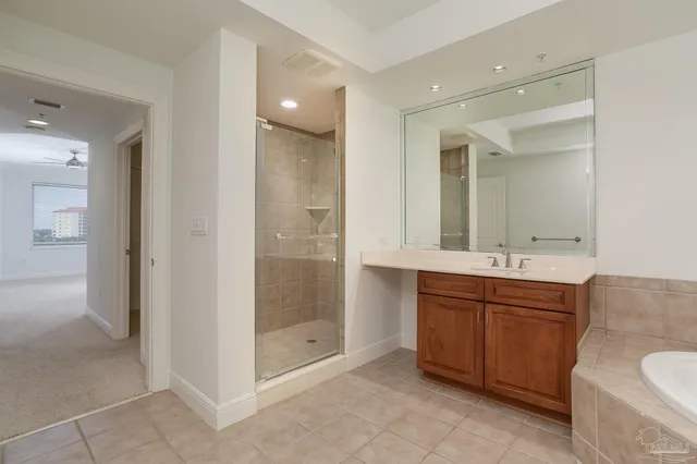 a bathroom with a shower sink and mirror