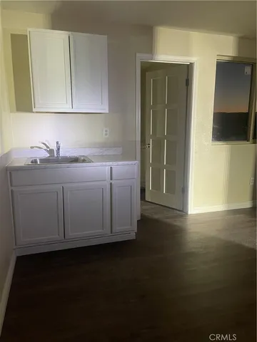 a kitchen with a sink and cabinets