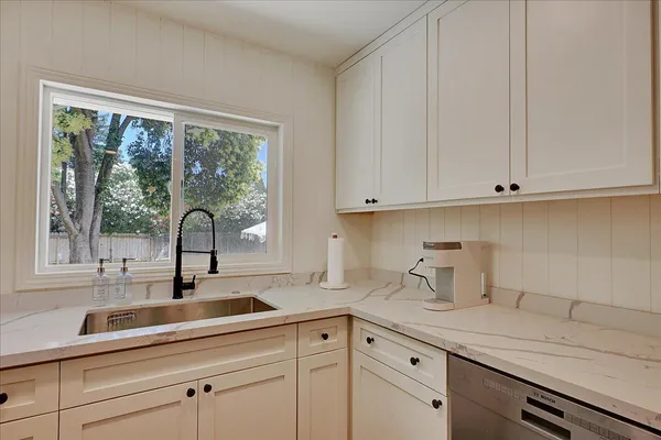 a bathroom with a sink and mirror