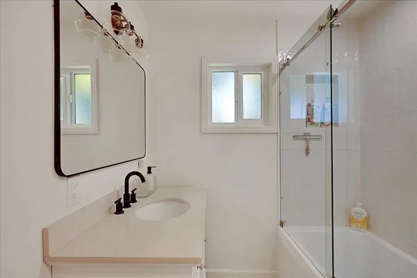 a kitchen with a sink and refrigerator